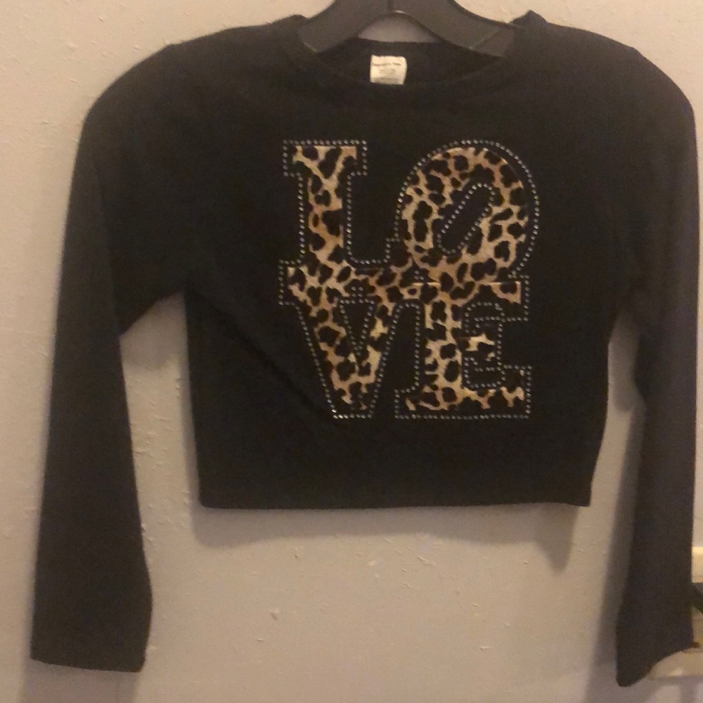 Girls cheetah print shirt.